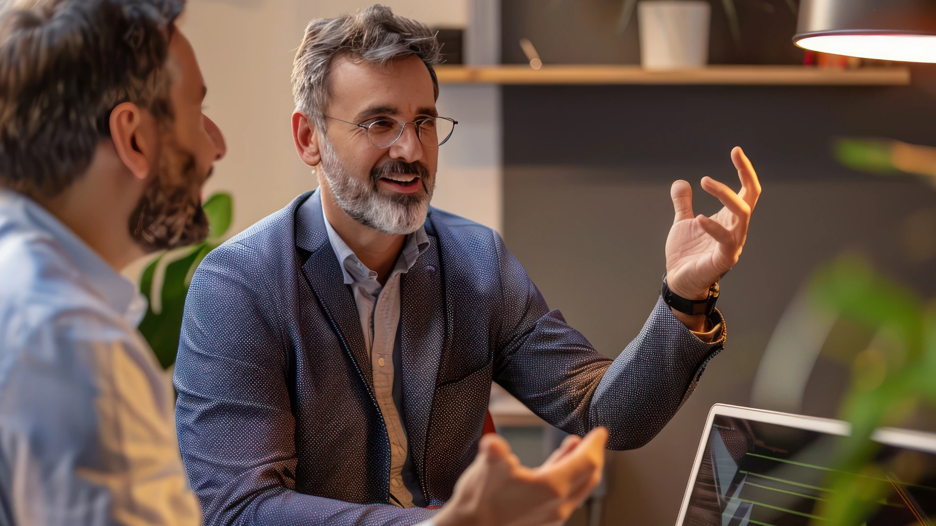 2 men, one discussing and one listens about strategy of exit product