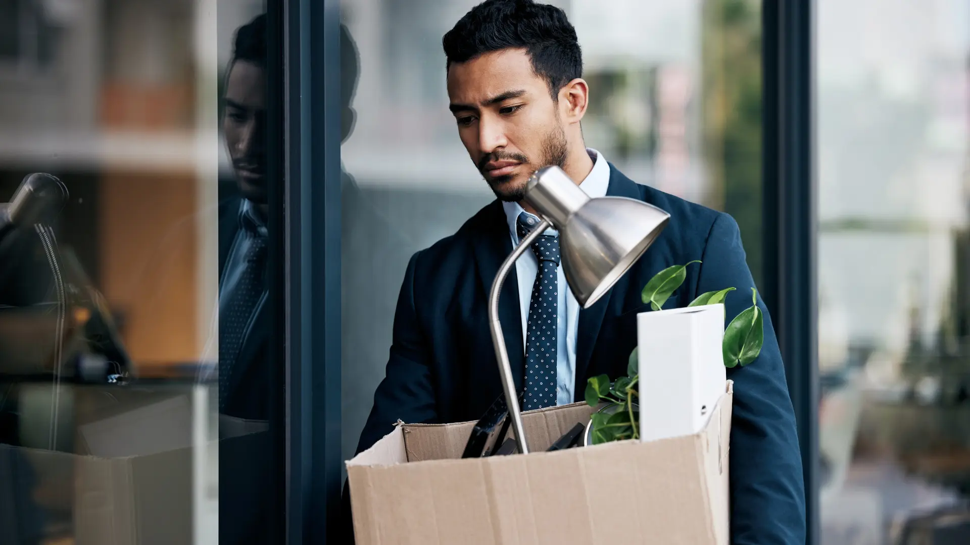 man packing up things showing business mistakes